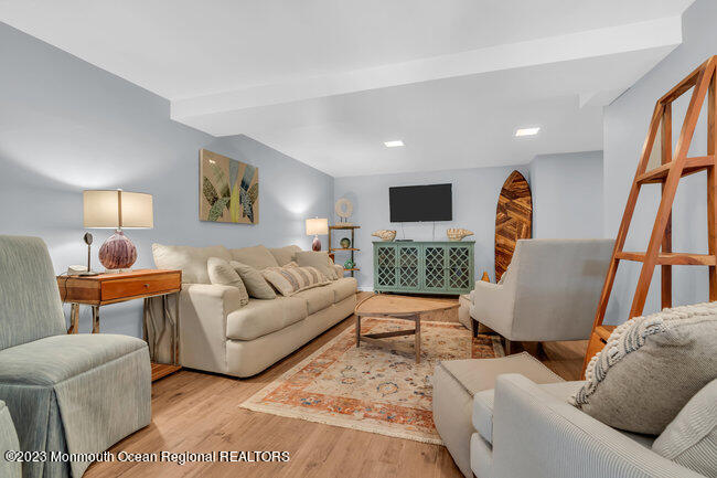 809 Lake Drive Spring Lake, NJ 07762 - Photo 19 of 34 a living room with furniture and a wooden floor