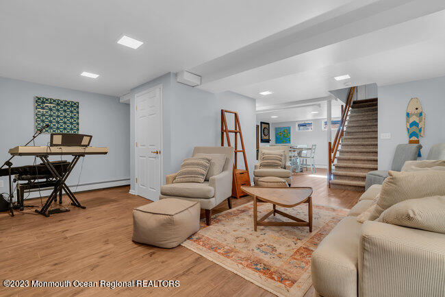 809 Lake Drive Spring Lake, NJ 07762 - Photo 21 of 34 a living room with furniture and a wooden floor