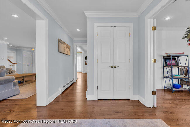 809 Lake Drive Spring Lake, NJ 07762 - Photo 3 of 34 wooden floor in a hall with an entryway and livingroom