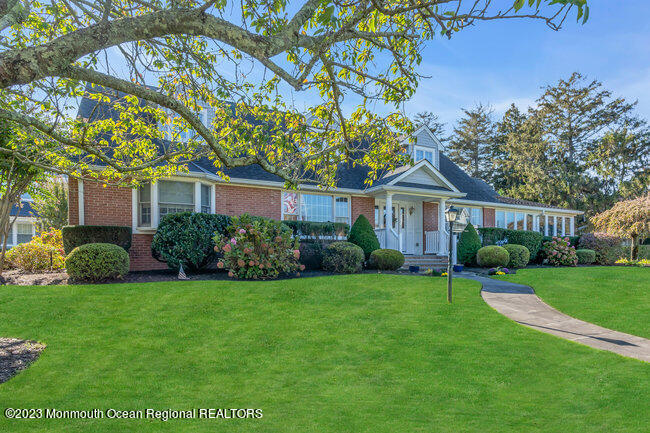 809 Lake Drive Spring Lake, NJ 07762 - Photo 34 of 34 a front view of a house with a garden