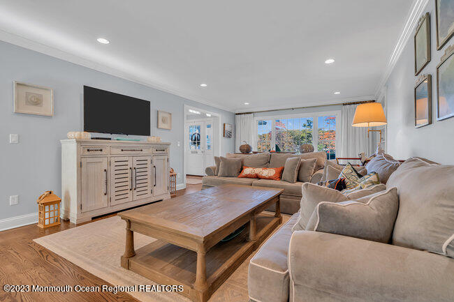 809 Lake Drive Spring Lake, NJ 07762 - Photo 7 of 34 a living room with furniture and a flat screen tv