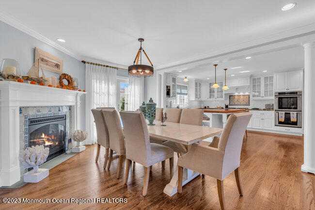 809 Lake Drive Spring Lake, NJ 07762 - Photo 8 of 34 a view of a dining room with furniture window and wooden floor