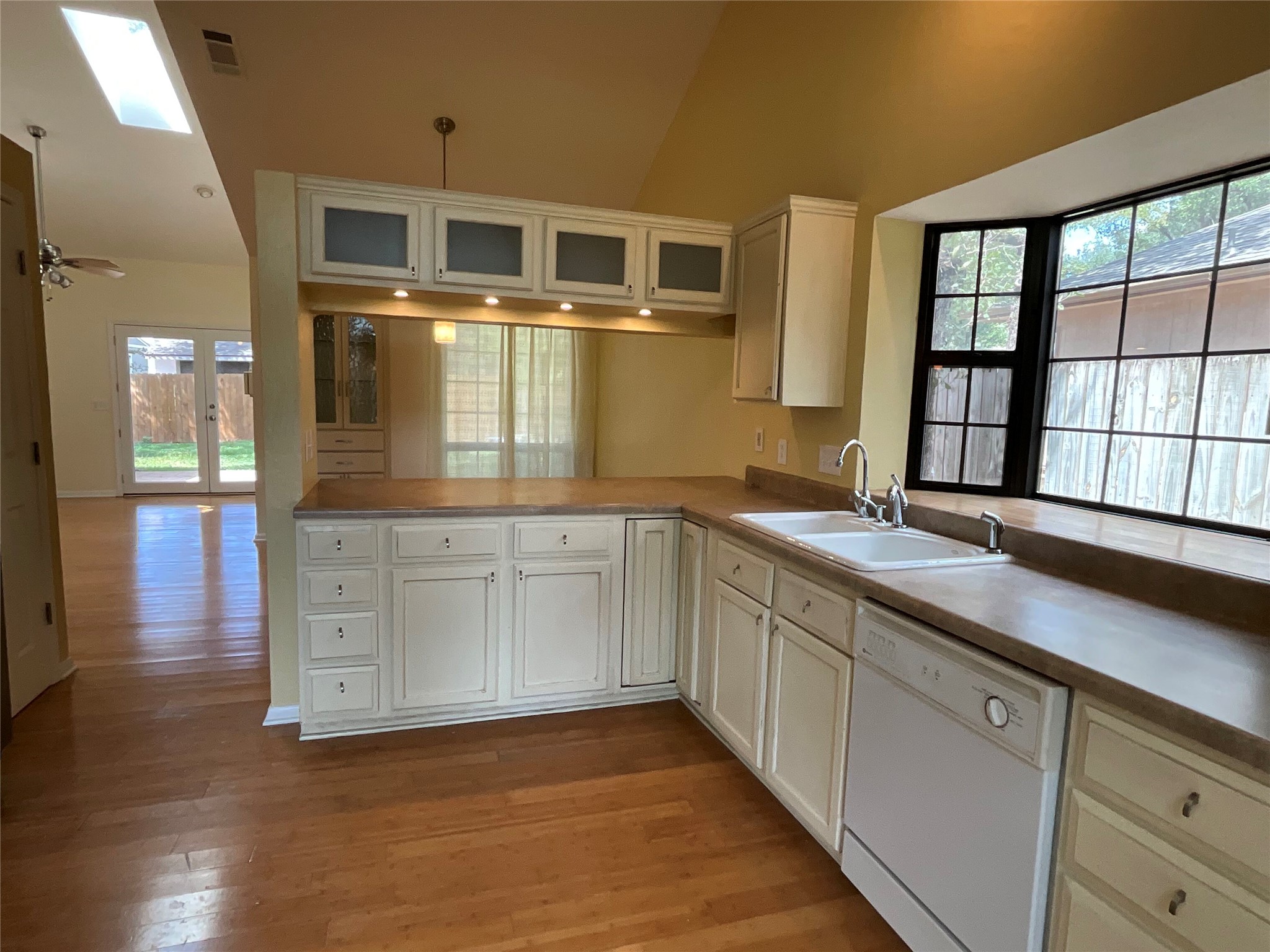 15702 Racine Cove Austin, TX 78717 - Photo 13 of 27 A well-equipped kitchen features ample counter space and a convenient layout, overlooking a naturally illuminated living area.