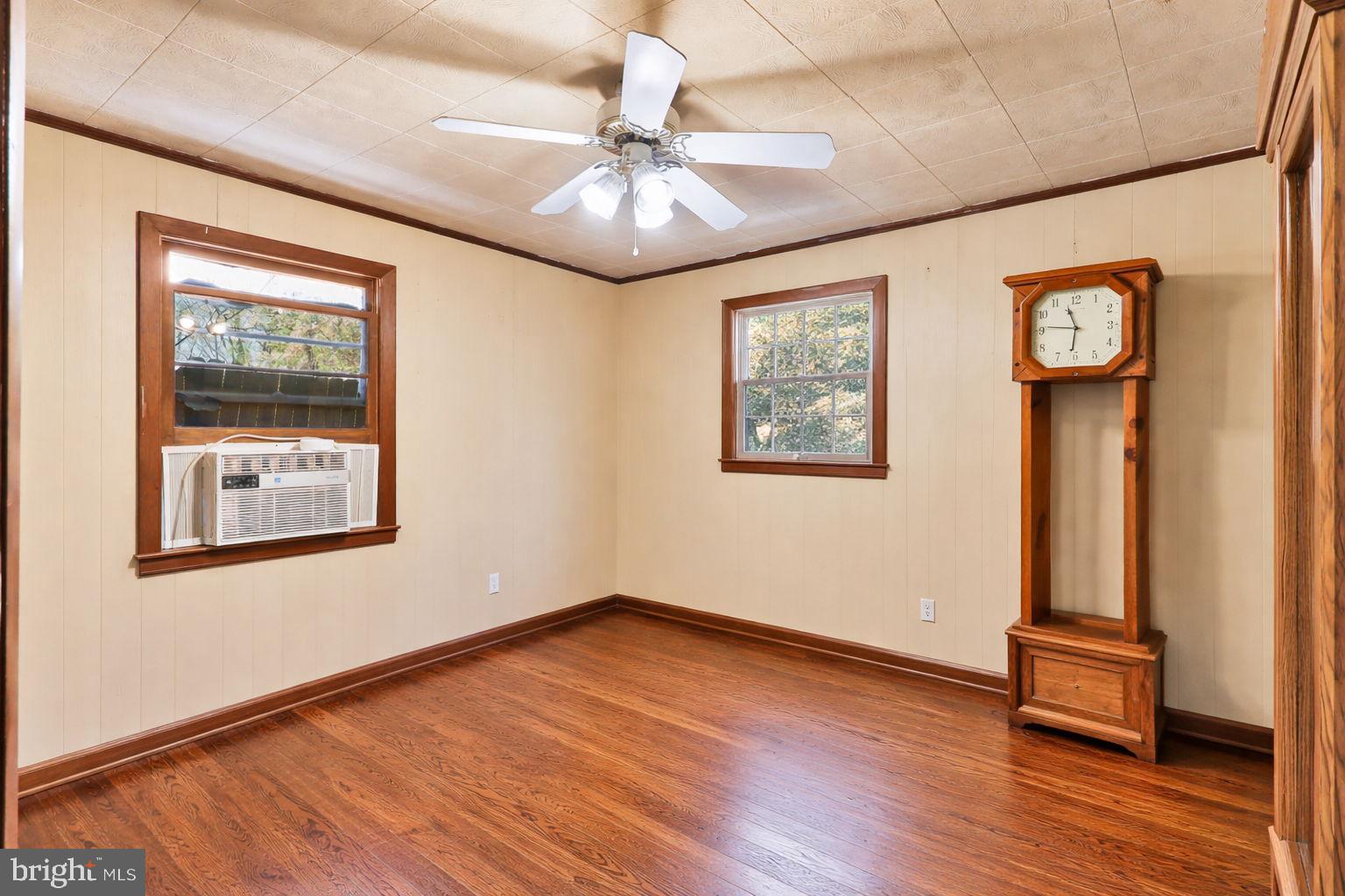 479 Hemlock Lane Bluemont, VA 20135 - Photo 12 of 17 an empty room with wooden floor and windows