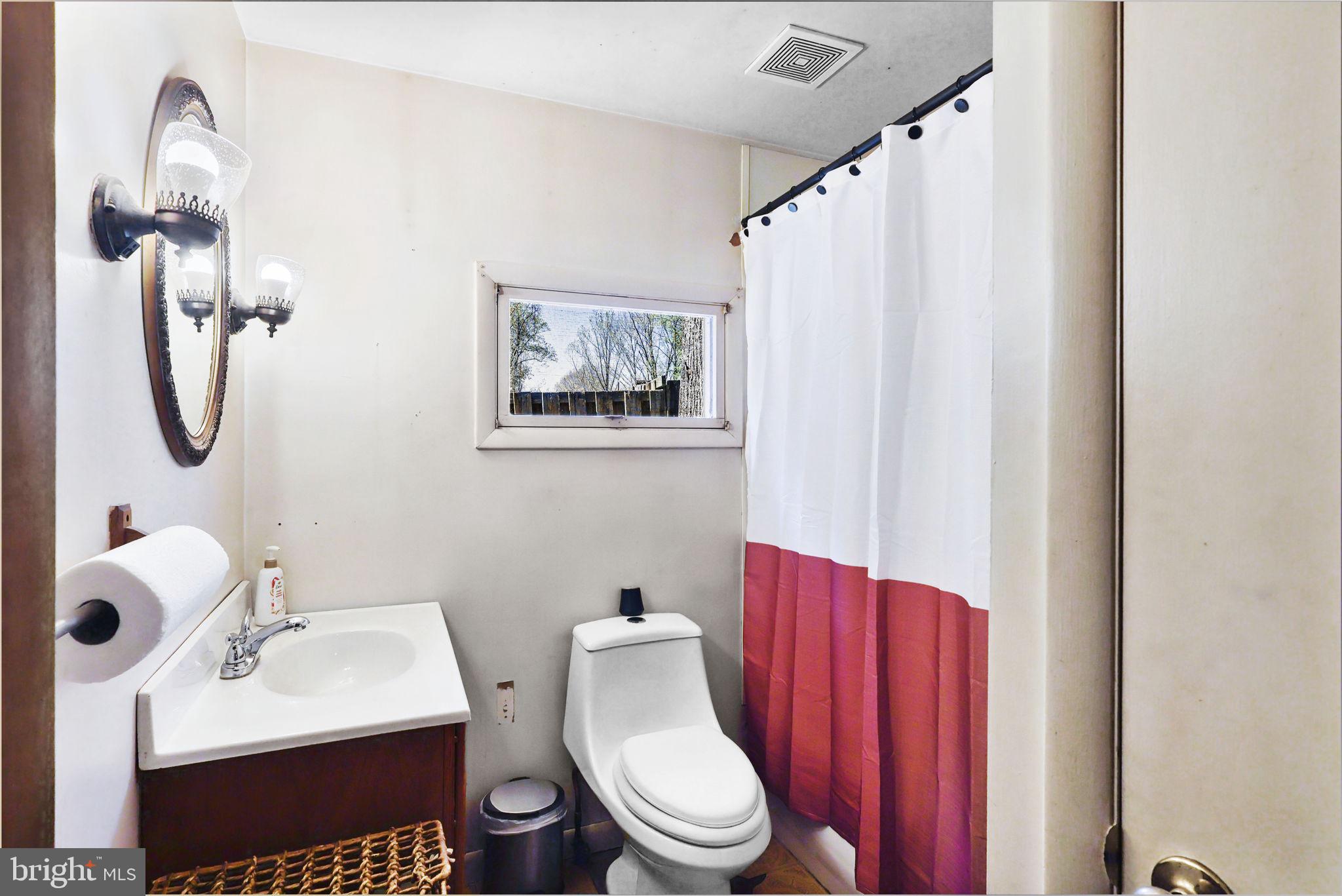479 Hemlock Lane Bluemont, VA 20135 - Photo 14 of 17 a white toilet sitting next to a bathroom sink