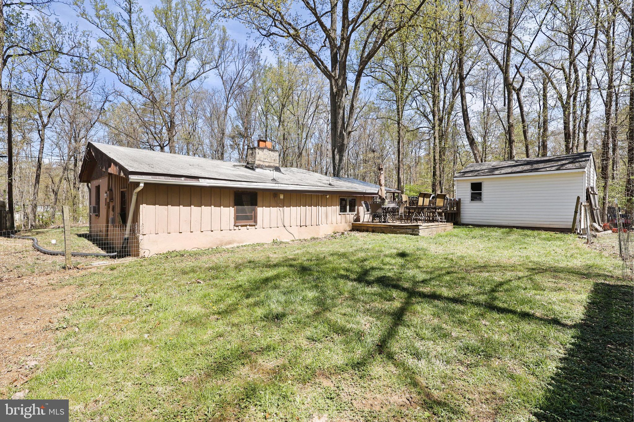 479 Hemlock Lane Bluemont, VA 20135 - Photo 17 of 17 a front view of house with yard and trees around