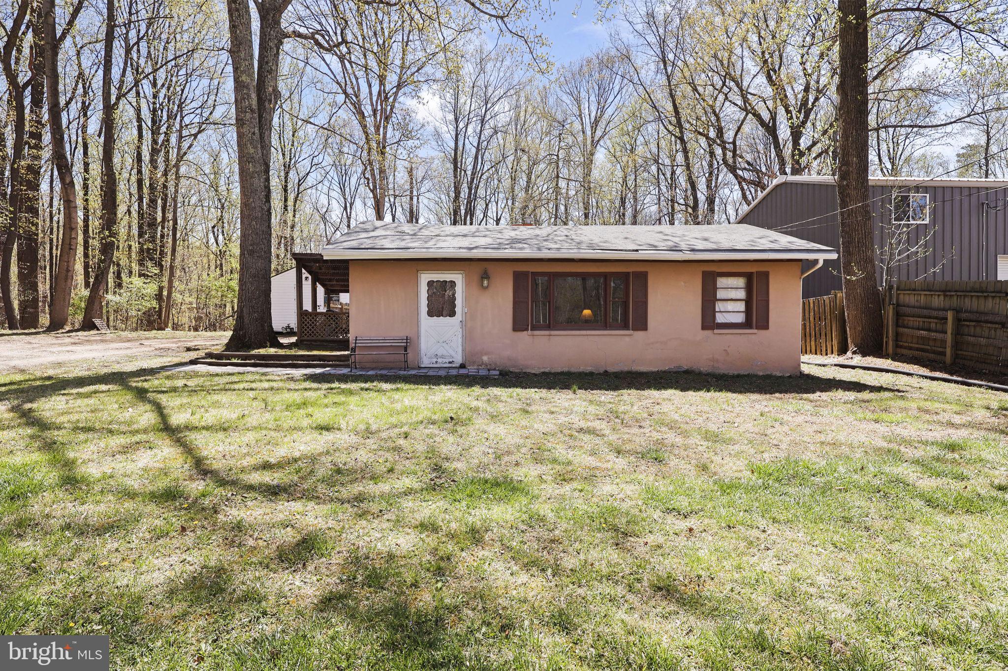 479 Hemlock Lane Bluemont, VA 20135 - Photo 2 of 17 a view of a house with a yard and large tree