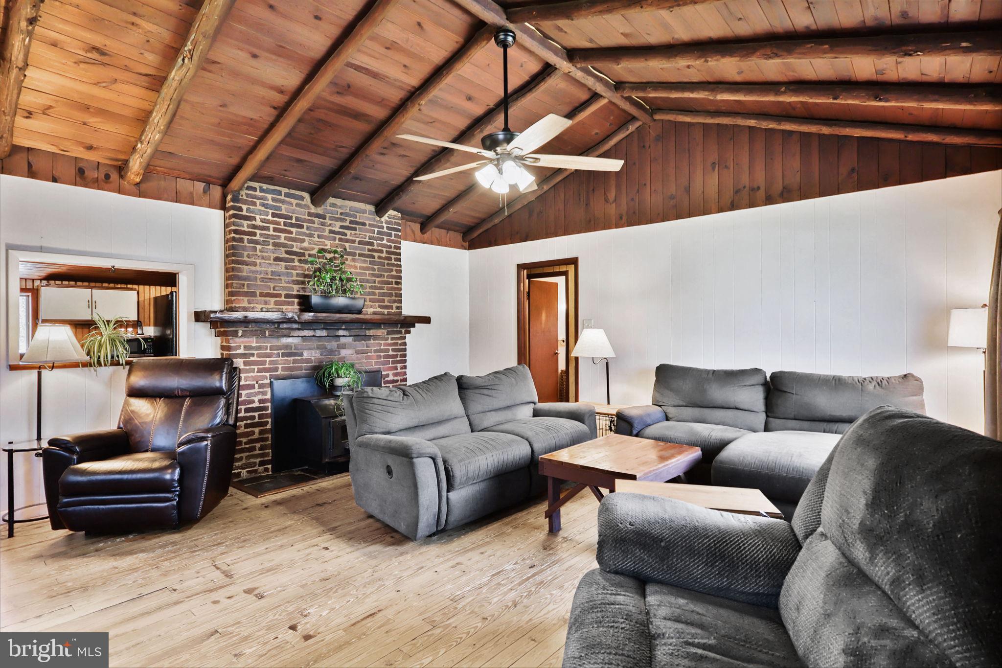 479 Hemlock Lane Bluemont, VA 20135 - Photo 4 of 17 a living room with furniture and a fireplace