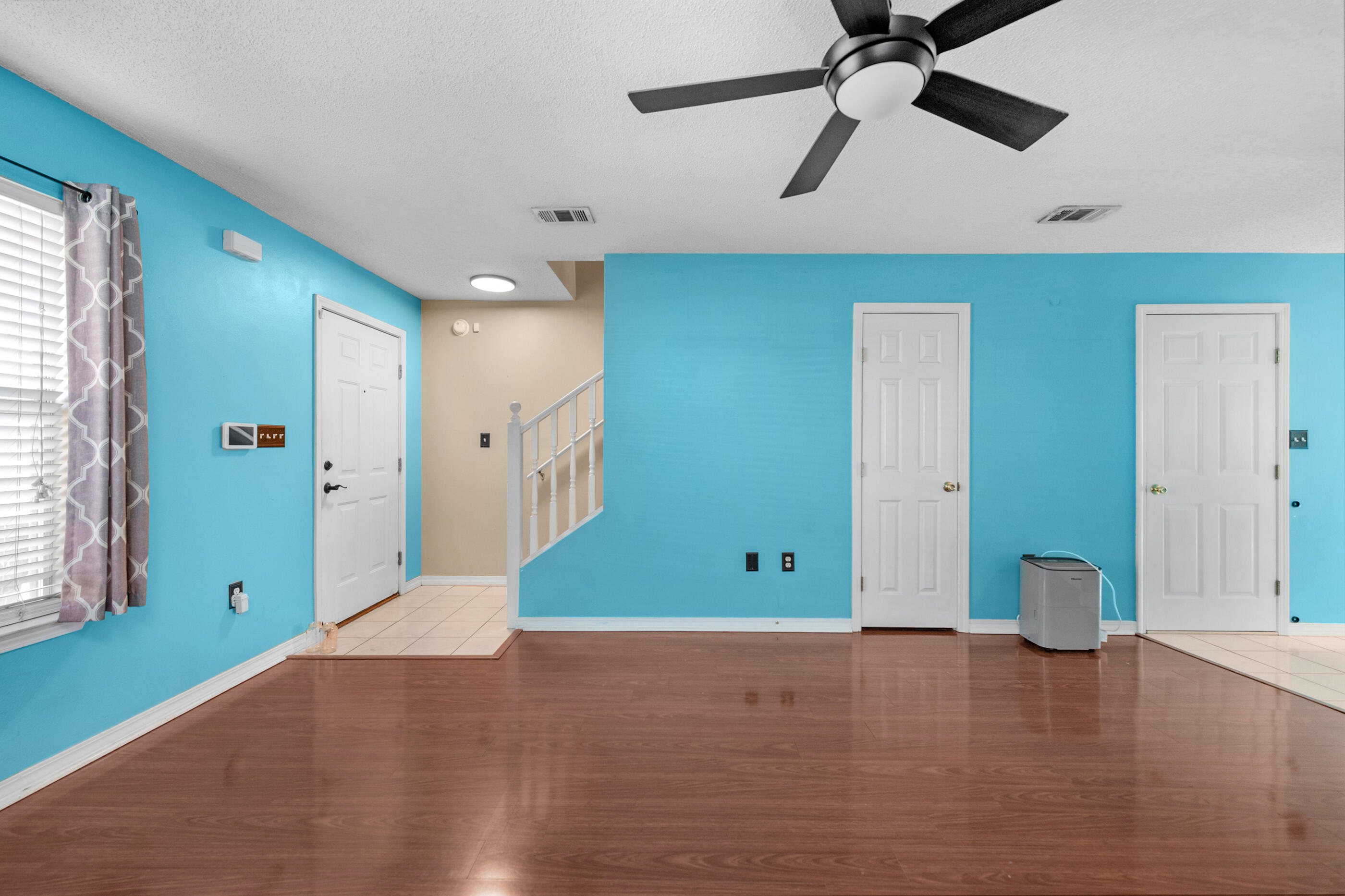 1810 Pointed Leaf Lane Fort Walton Beach, FL 32547 - Photo 12 of 24 a view of an empty room with window and wooden floor