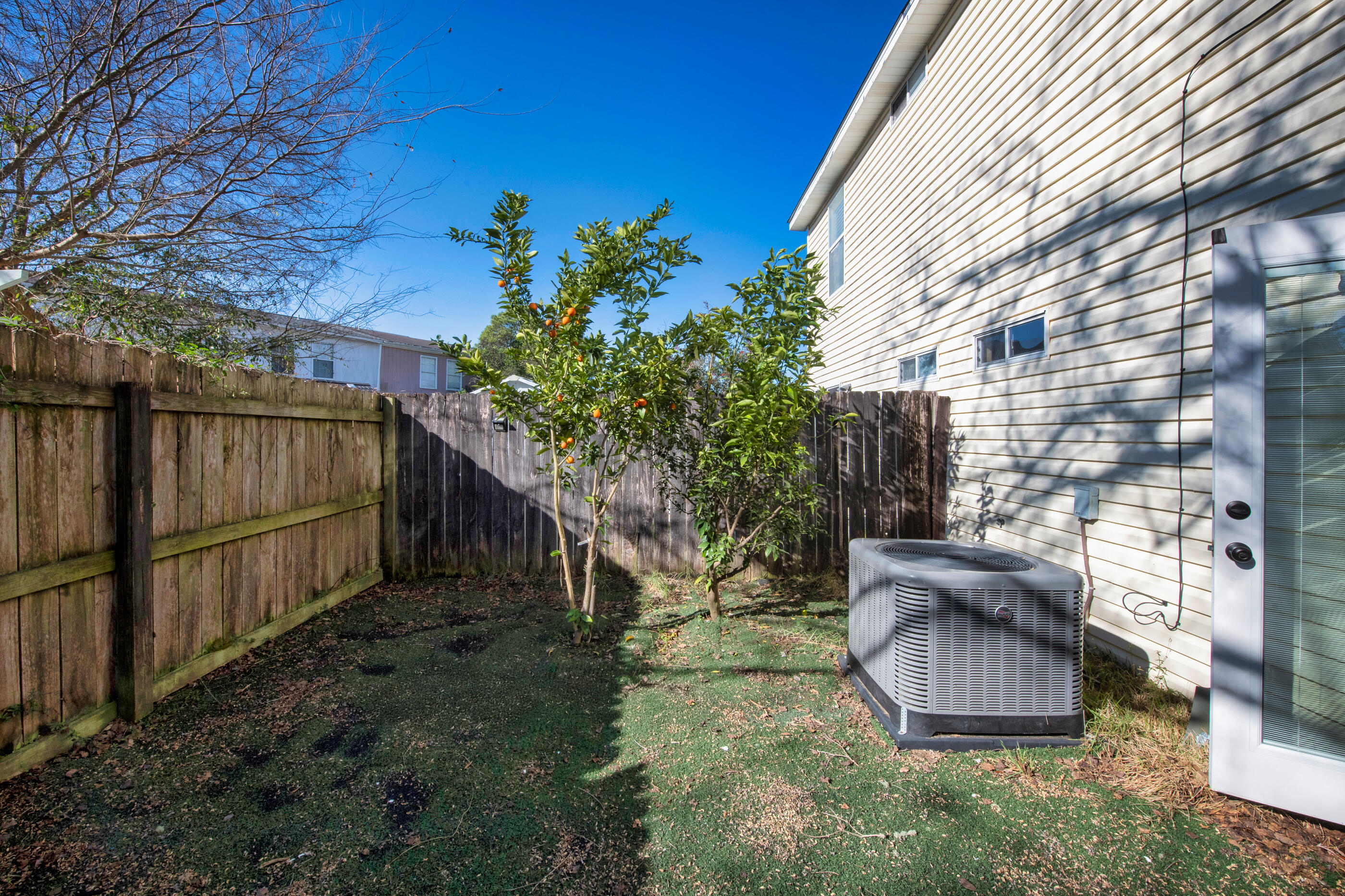 1810 Pointed Leaf Lane Fort Walton Beach, FL 32547 - Photo 23 of 24 a view of backyard with outdoor seating and plants
