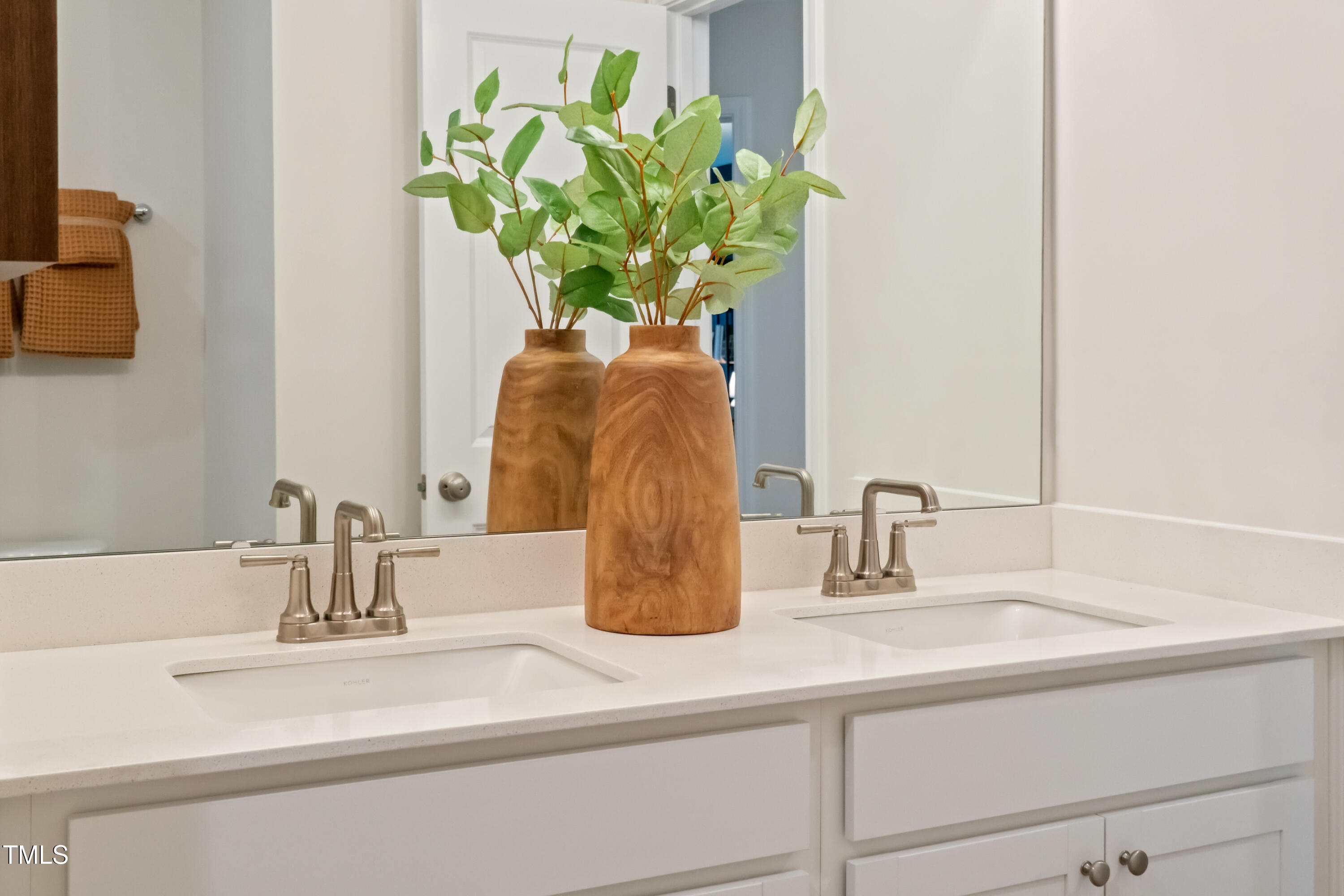 4911 Caddis Bend Raleigh, NC 27604 - Photo 21 of 30 a bathroom sink a mirror