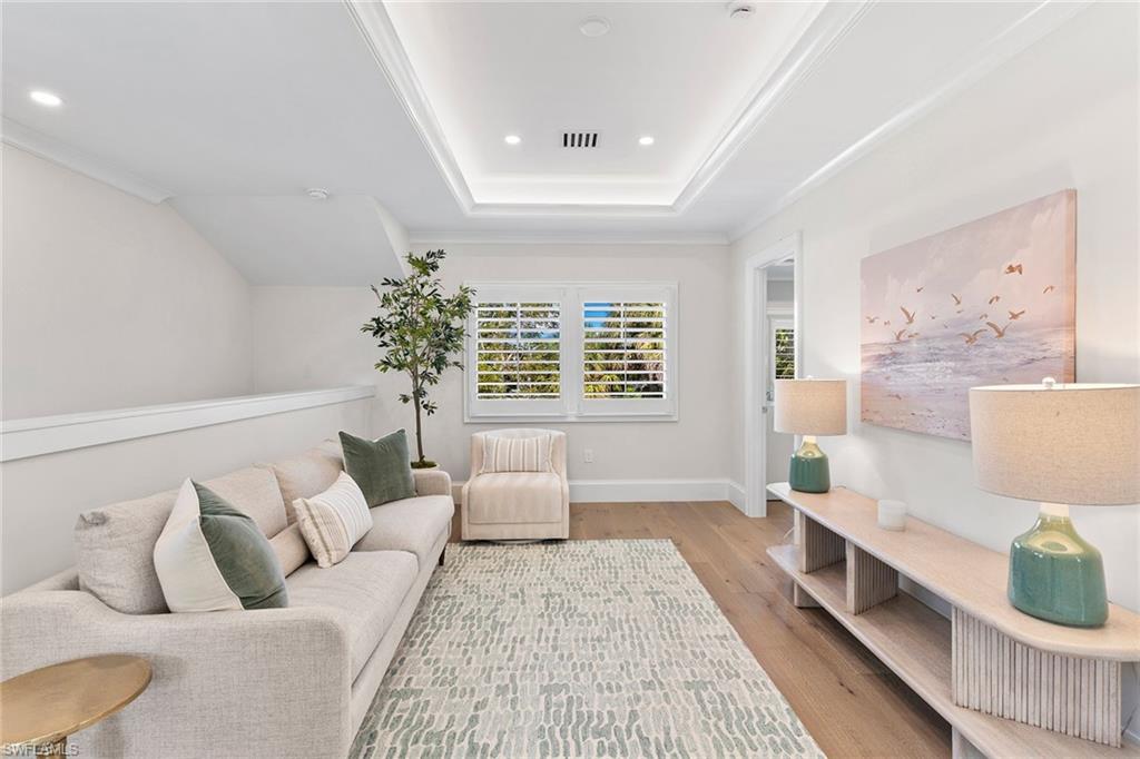 810 9th Street South Naples, FL 34102 - Photo 17 of 32 a living room with furniture and a large window