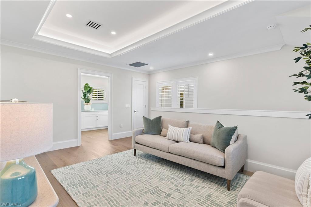 810 9th Street South Naples, FL 34102 - Photo 18 of 32 a living room with furniture and wooden floor