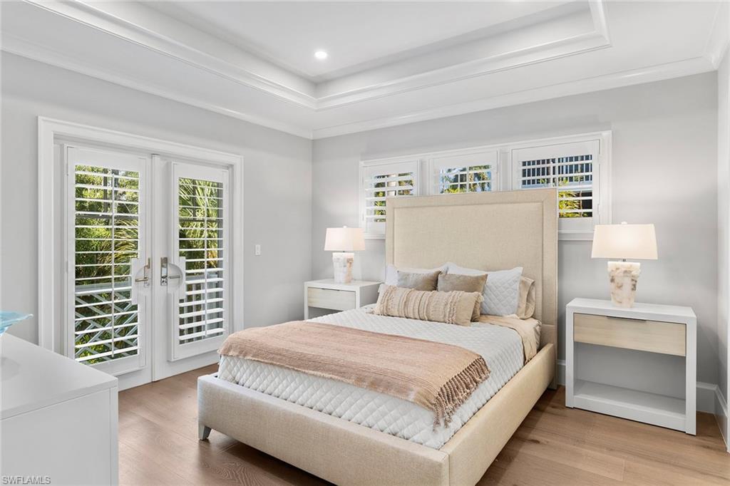 810 9th Street South Naples, FL 34102 - Photo 19 of 32 a bedroom with a large bed and a window