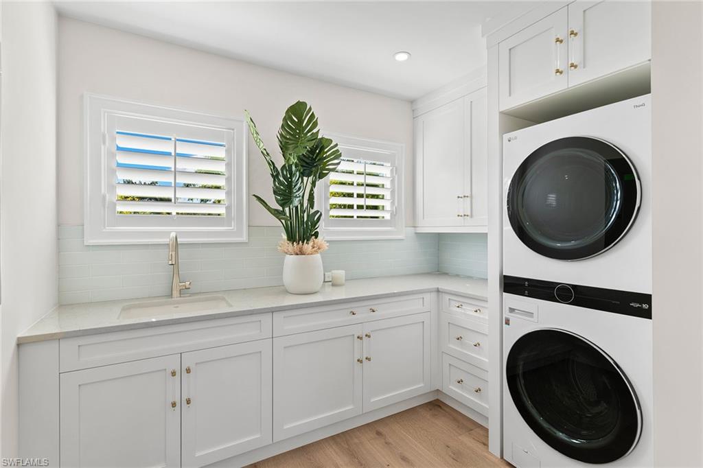 810 9th Street South Naples, FL 34102 - Photo 25 of 32 a kitchen with a sink and a vanity