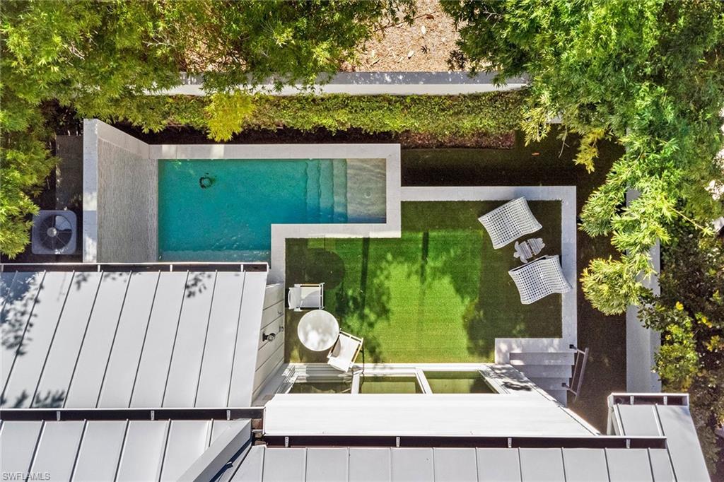 810 9th Street South Naples, FL 34102 - Photo 28 of 32 a view of swimming pool with a patio