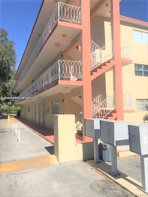 2441 Northwest 13th Street, Unit 71 Miami, FL 33125 - Photo 2 of 12 a view of a outdoor space with a patio