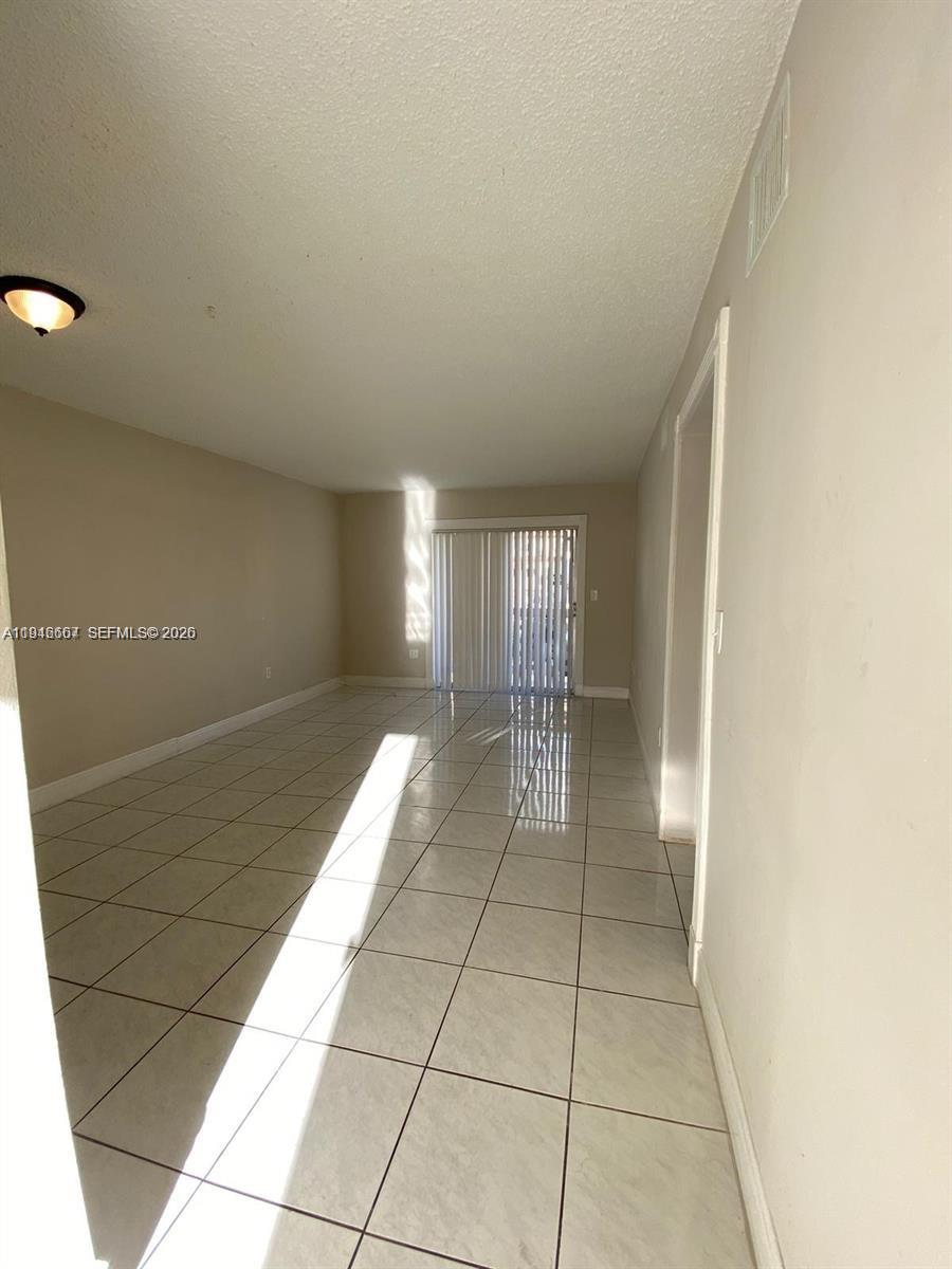 2441 Northwest 13th Street, Unit 71 Miami, FL 33125 - Photo 7 of 12 a view of entryway with stairs
