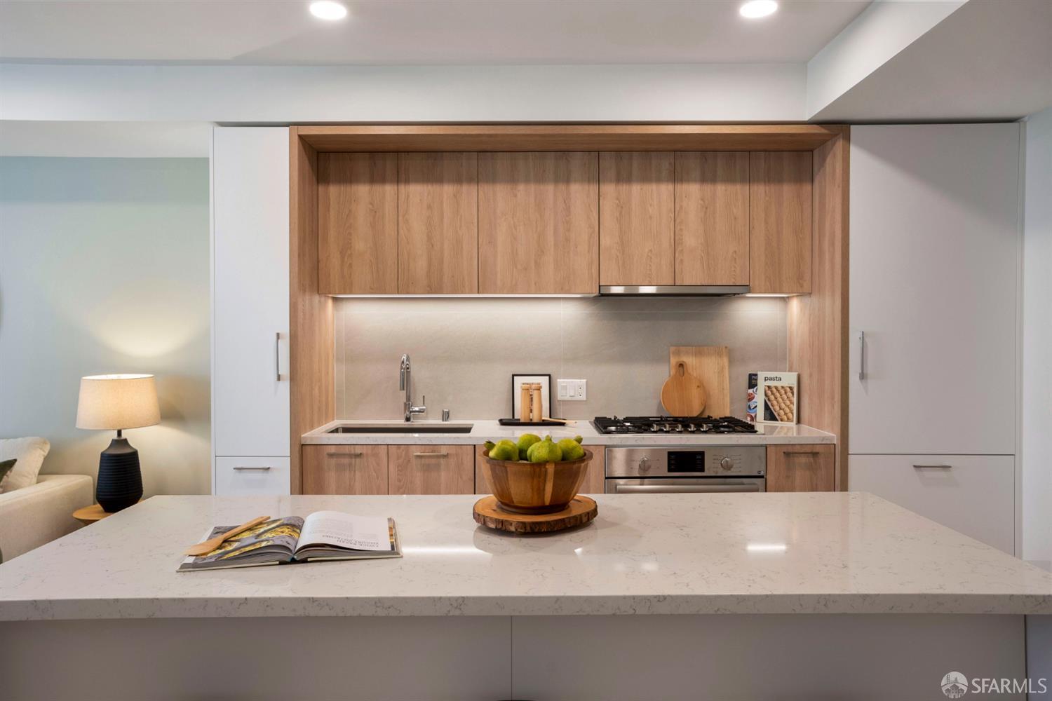 915 North Point Street, Unit F2 San Francisco, CA 94109 - Photo 3 of 16 a kitchen with a sink cabinets and appliances