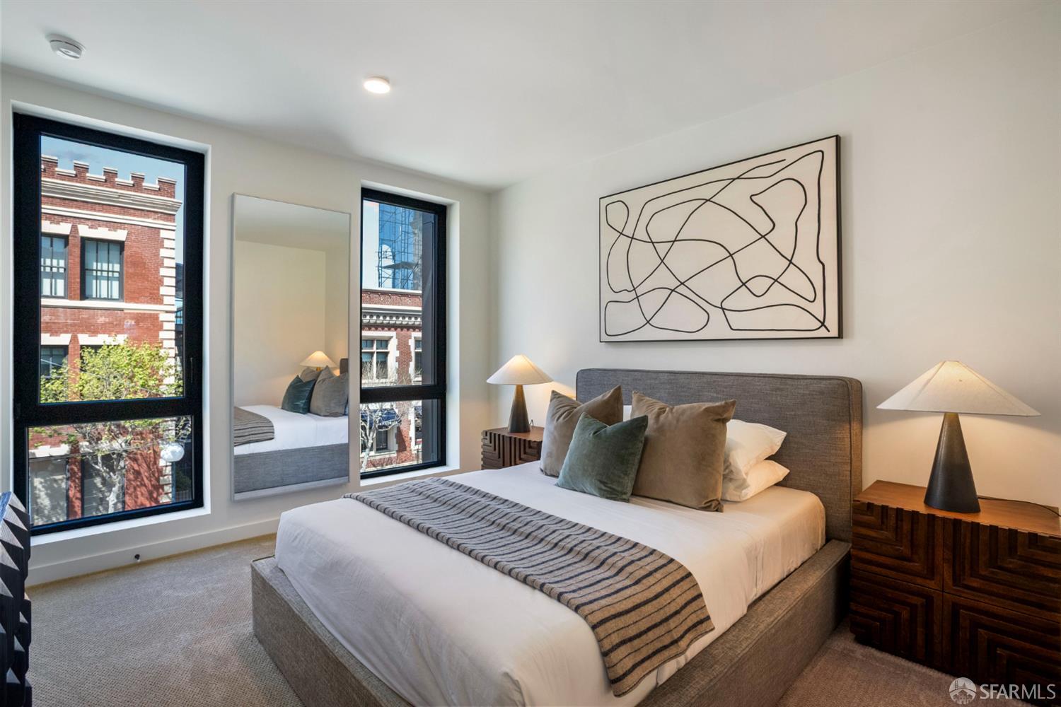 915 North Point Street, Unit F2 San Francisco, CA 94109 - Photo 5 of 16 a bedroom with a bed and a large window