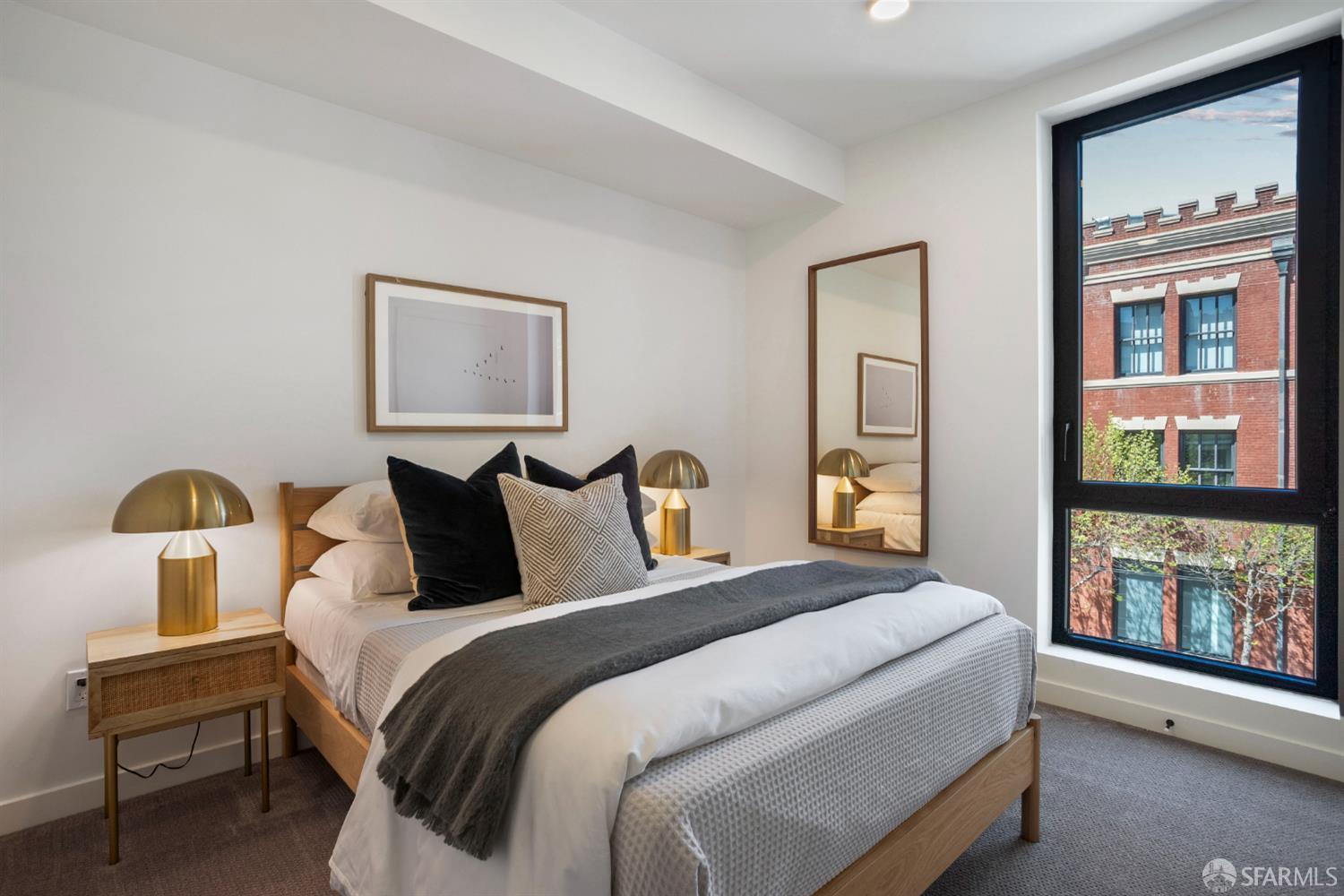 915 North Point Street, Unit F2 San Francisco, CA 94109 - Photo 6 of 16 a bedroom with a bed and a painting on the wall