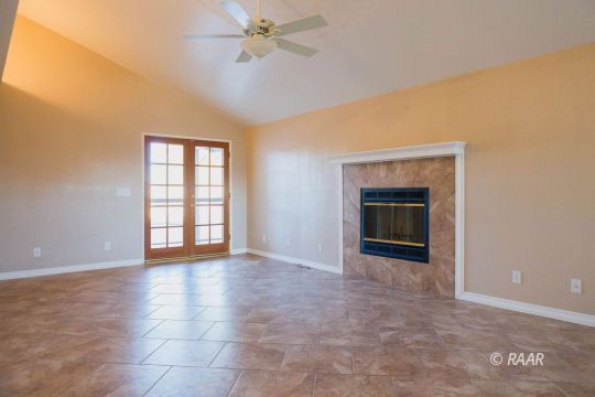 1116 Lee Avenue Ridgecrest, CA 93555 - Photo 8 of 32 an empty room with windows and fireplace
