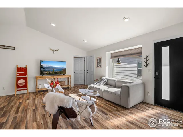 a bedroom with a bed and a television