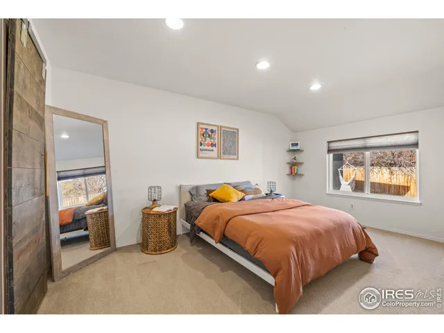 a bedroom with a bed and a closet