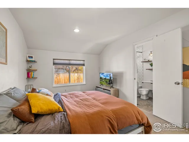 a living room with a couch and a large window