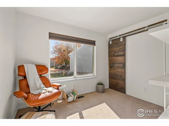 a view of a bedroom with shelves