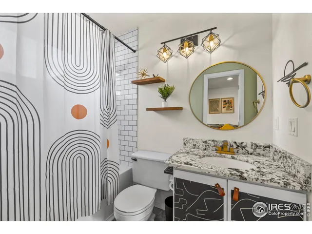 a bathroom with a sink a bathtub and a mirror