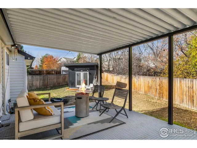 a house view with a sitting space and garden