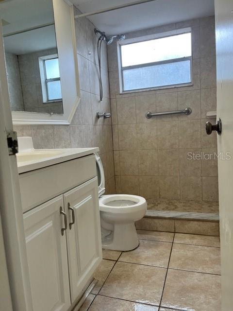 7034 Coral Reef Drive Port Richey, FL 34668 - Photo 7 of 9 a bathroom with a toilet sink and shower