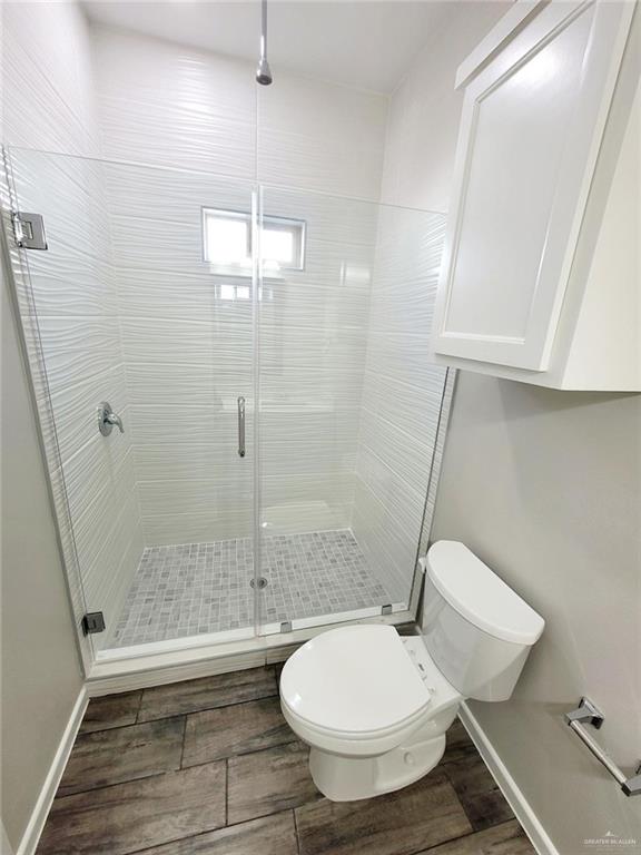 1312 Petri Drive, Unit 2 Weslaco, TX 78596 - Photo 14 of 15 a bathroom with a toilet and a shower