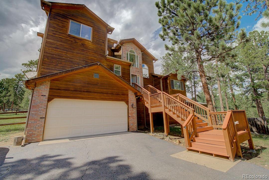 25 Buggy Whip Road Bailey, CO 80421 - Photo 2 of 40 a view of a house with a yard