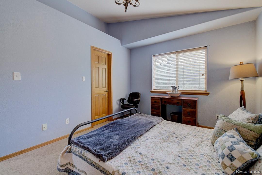 25 Buggy Whip Road Bailey, CO 80421 - Photo 29 of 40 a bed room with a bed and a window