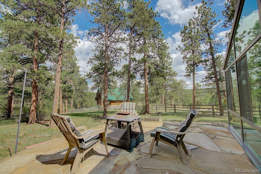 25 Buggy Whip Road Bailey, CO 80421 - Photo 38 of 40 a view of a backyard with sitting area