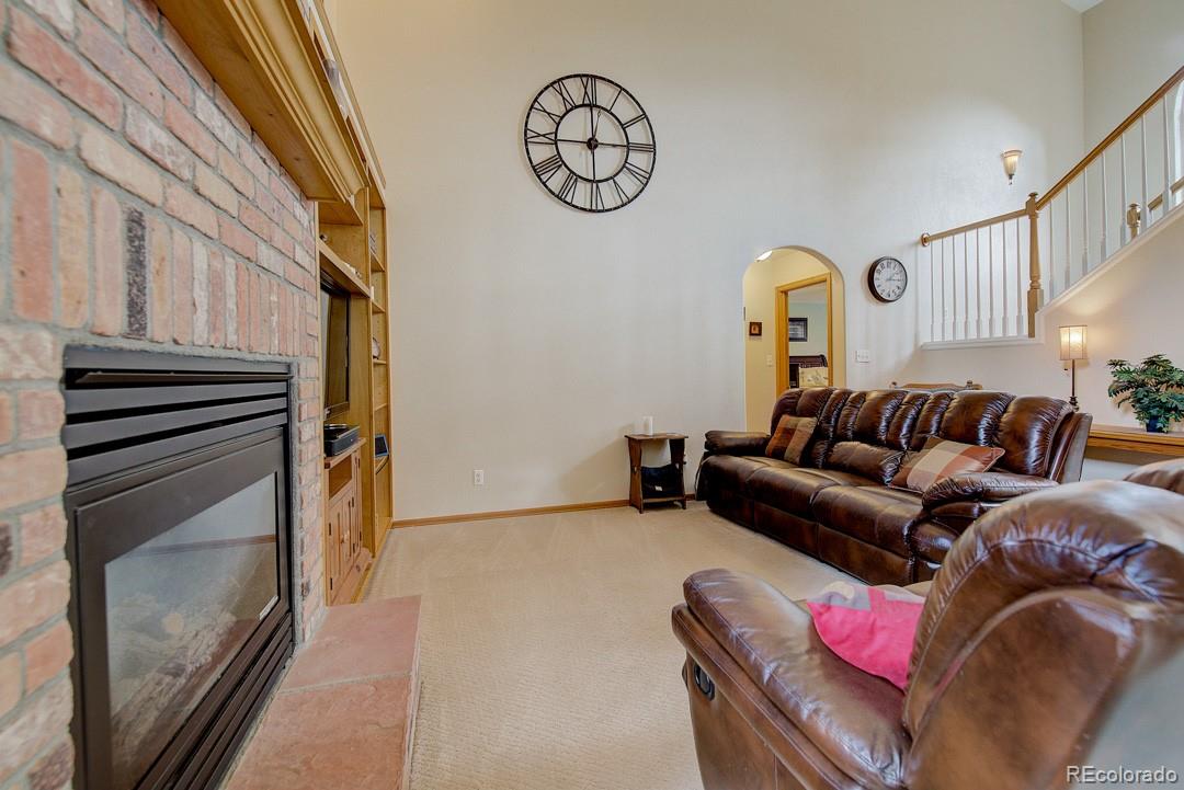 25 Buggy Whip Road Bailey, CO 80421 - Photo 5 of 40 a living room with furniture a rug and a window