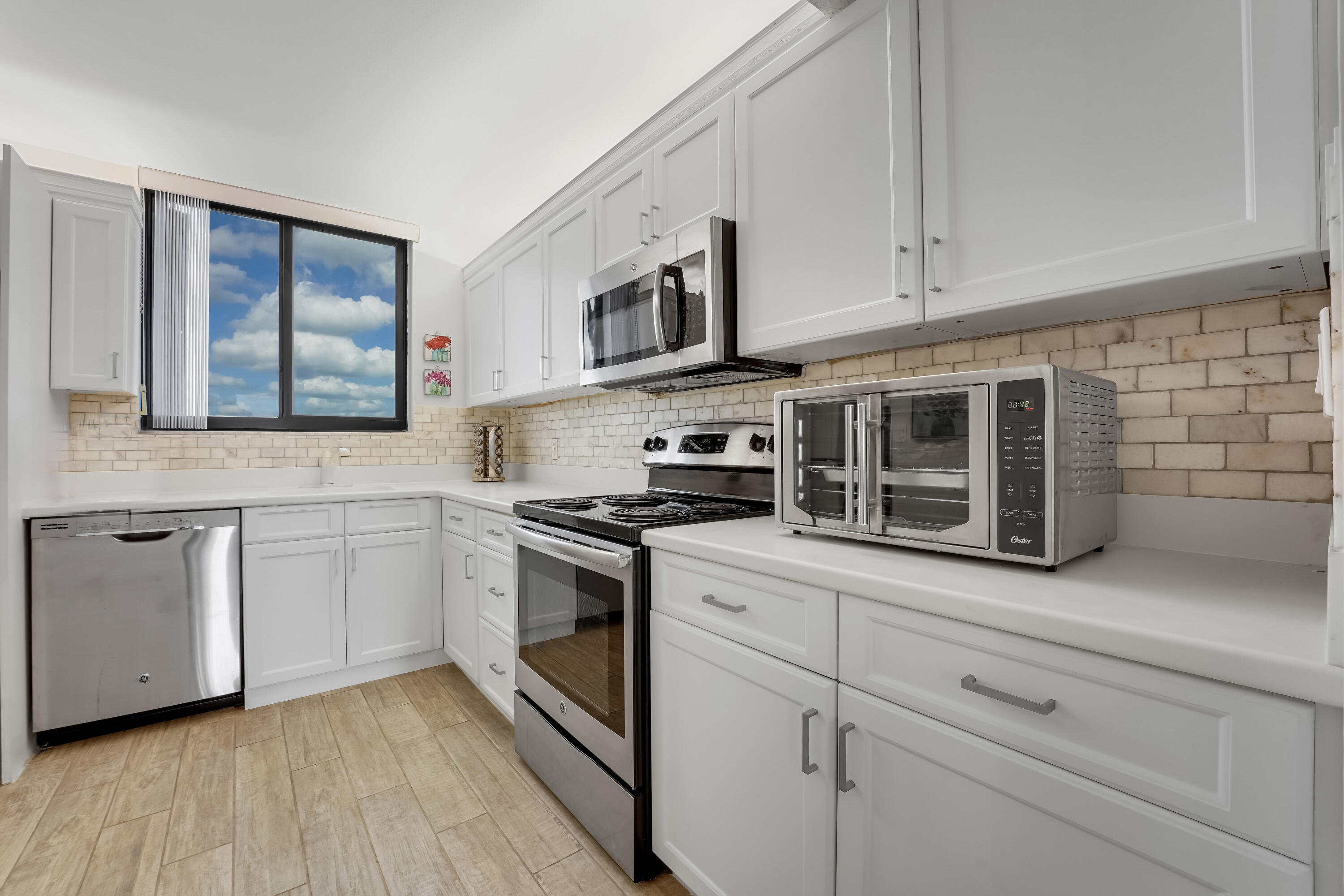 400 Ocean Trail Way, Unit 301 Jupiter, FL 33477 - Photo 6 of 22 Kitchen with ocean views