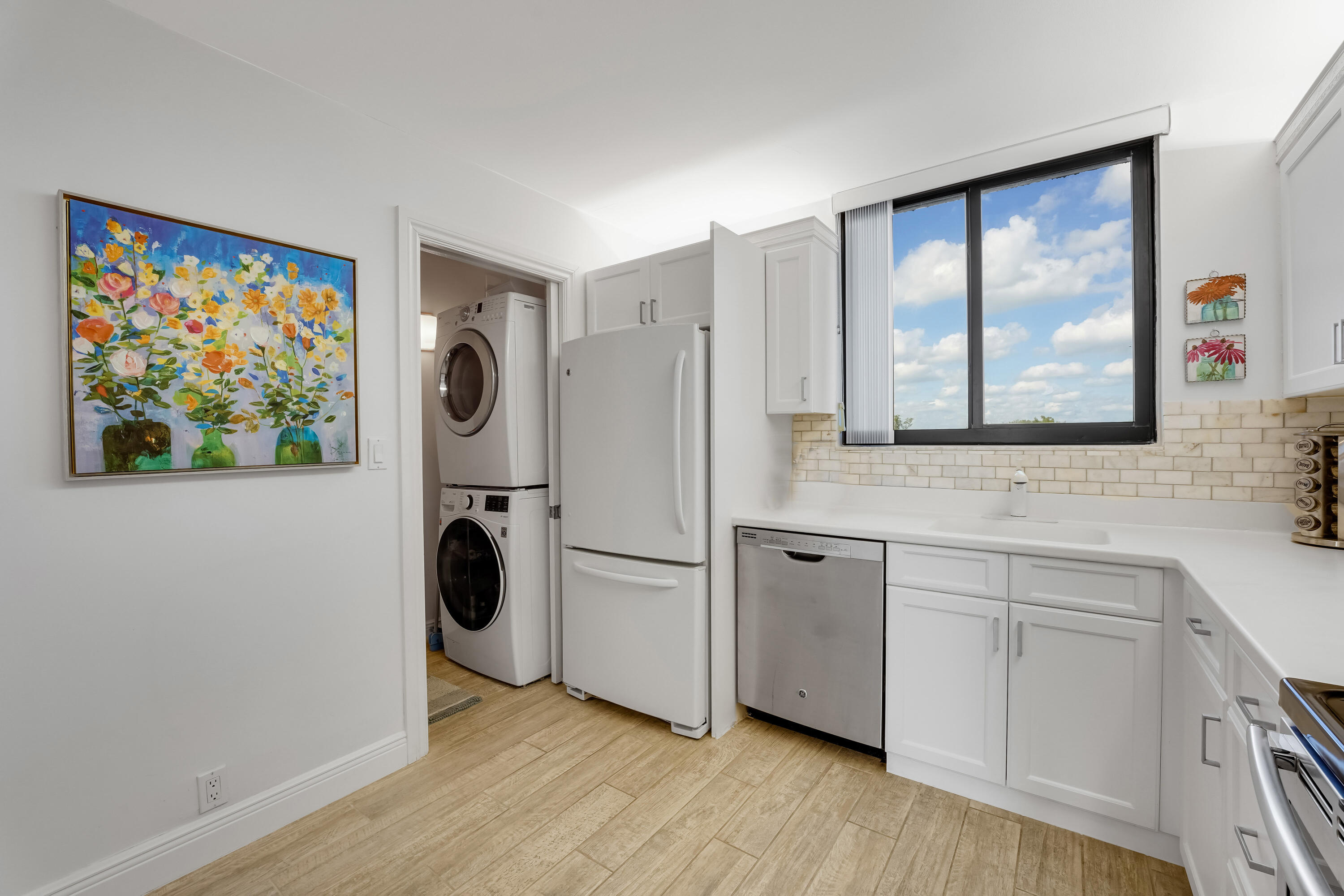 400 Ocean Trail Way, Unit 301 Jupiter, FL 33477 - Photo 8 of 22 Laundry and kitchen