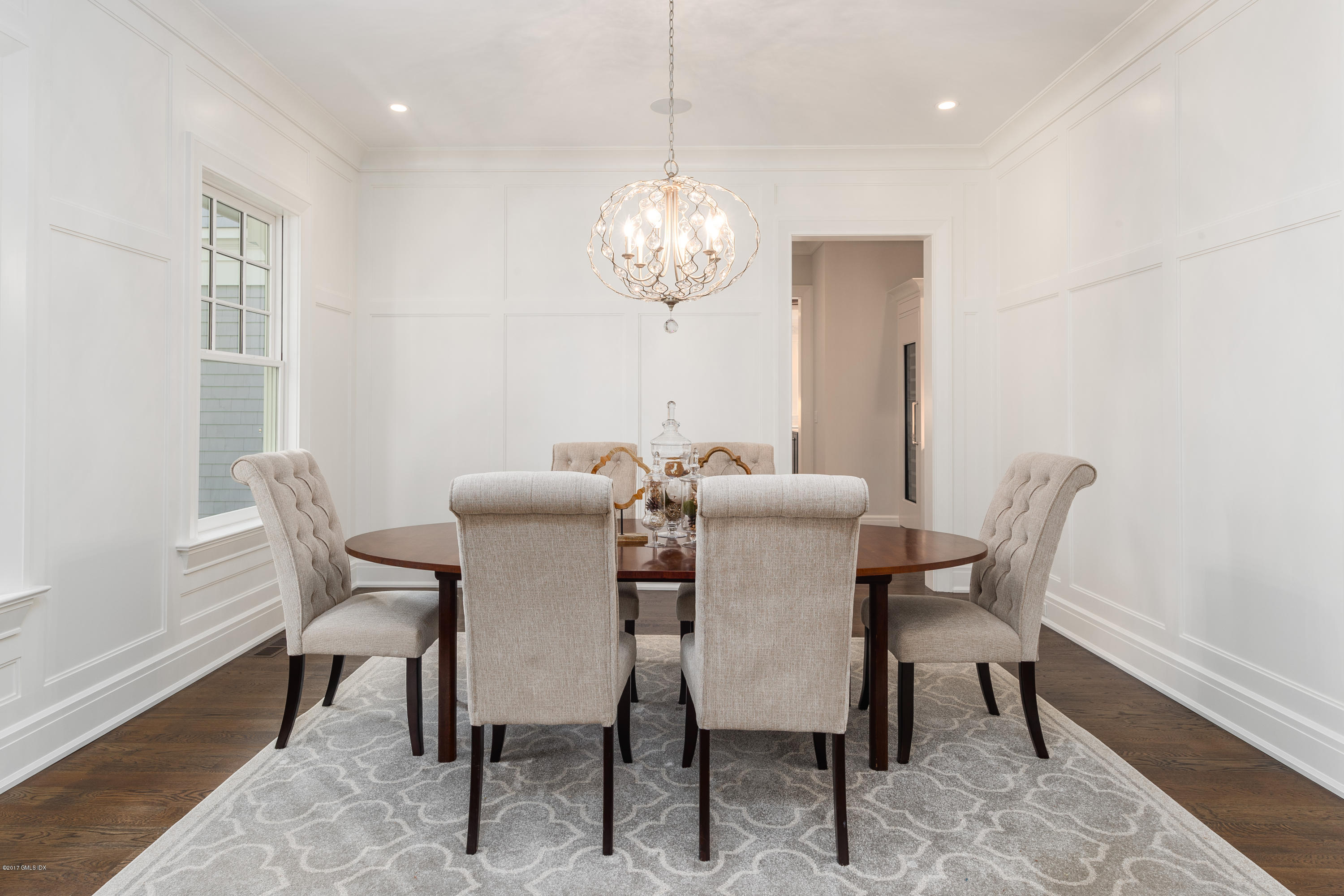 9 Shaw Place Riverside, CT 06878 - Photo 14 of 39 a view of a dining room with furniture a chandelier and wooden floor