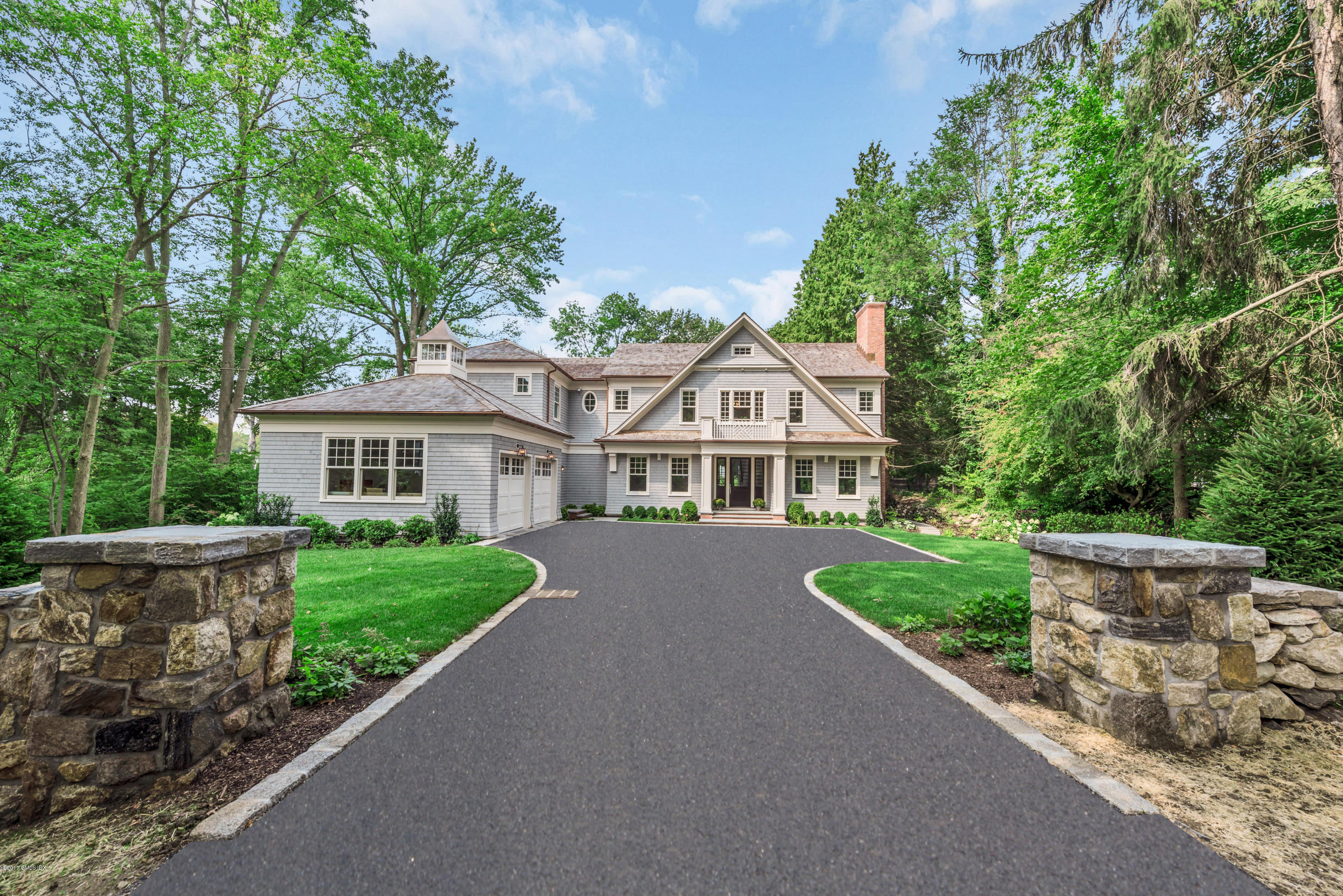 9 Shaw Place Riverside, CT 06878 - Photo 2 of 39 a front view of a house with a garden