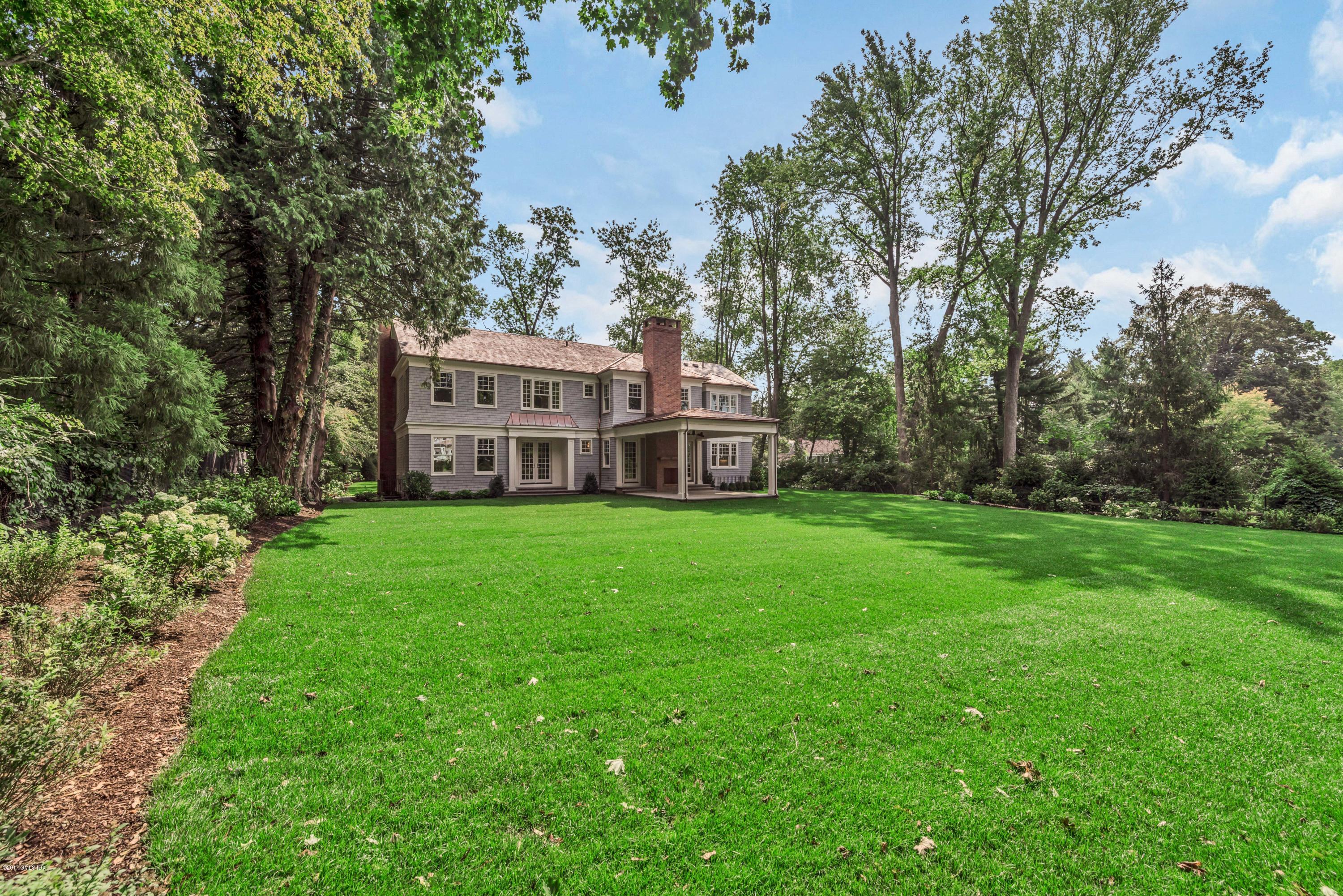 9 Shaw Place Riverside, CT 06878 - Photo 3 of 39 a view of a house with a big yard plants and large trees