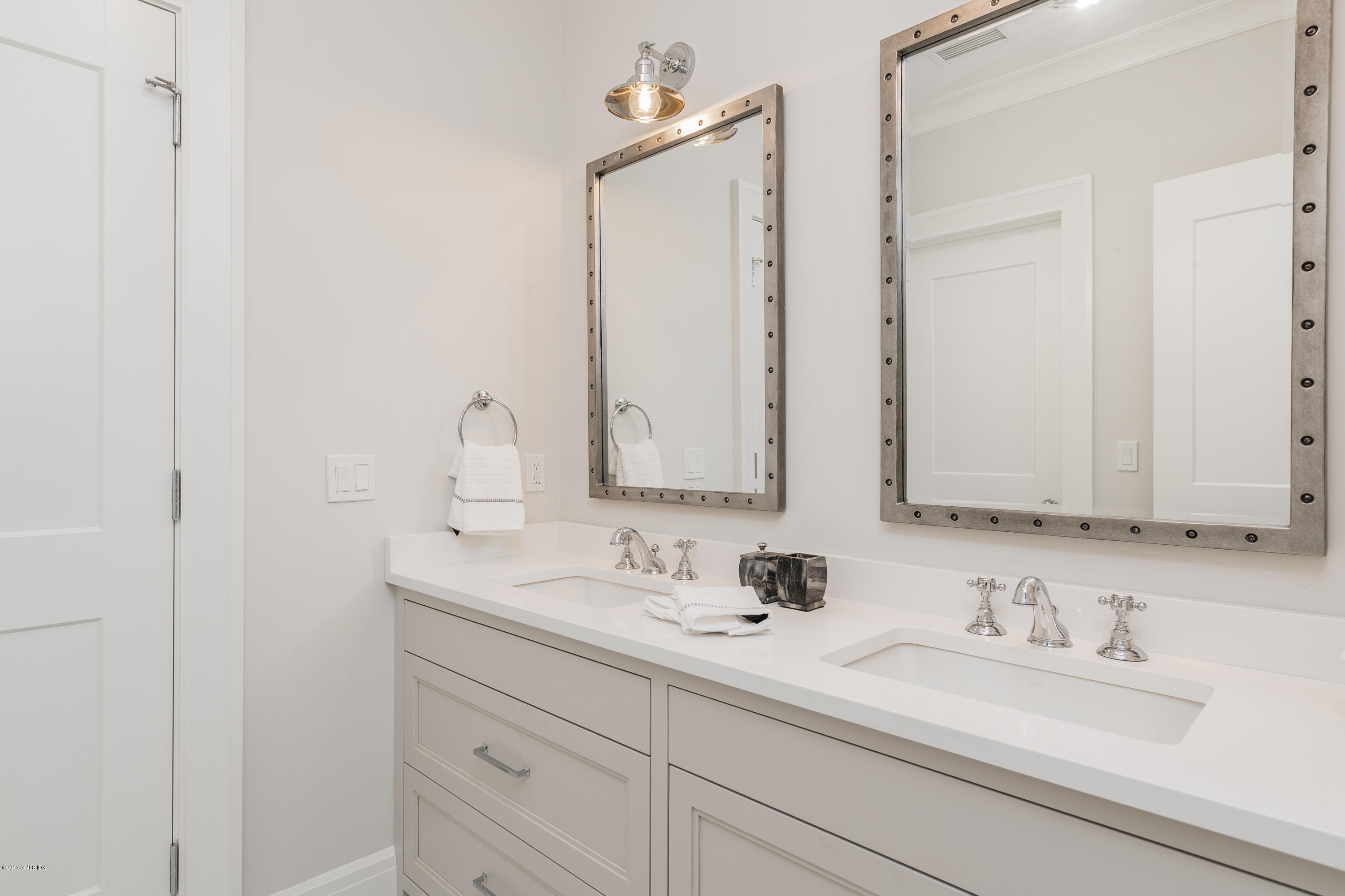 9 Shaw Place Riverside, CT 06878 - Photo 31 of 39 a bathroom with double sink and a mirror