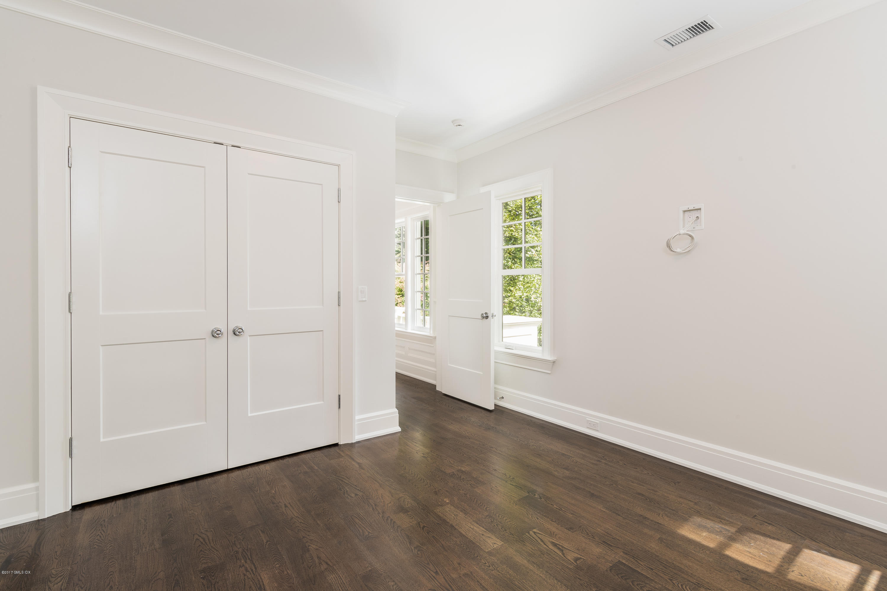 9 Shaw Place Riverside, CT 06878 - Photo 32 of 39 an empty room with wooden floor closet and windows