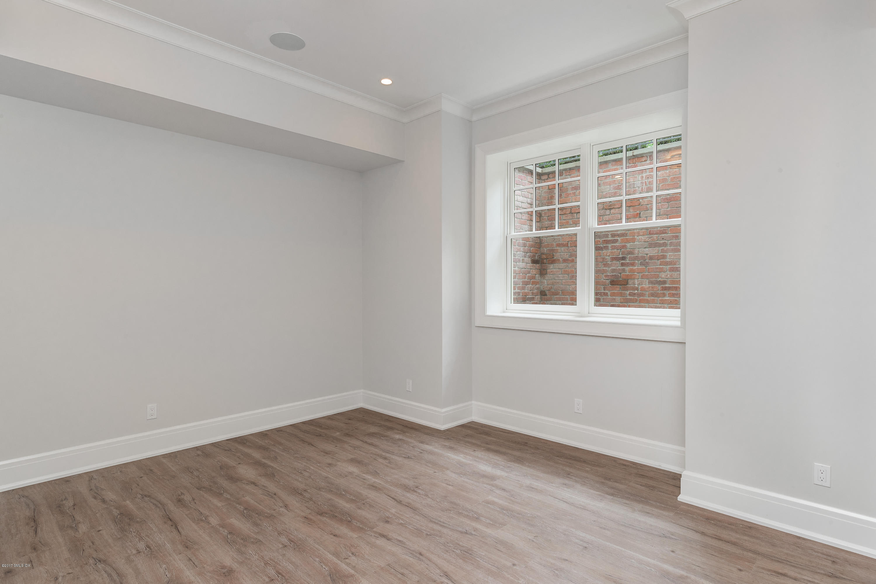 9 Shaw Place Riverside, CT 06878 - Photo 36 of 39 a view of empty room with wooden floor and fan