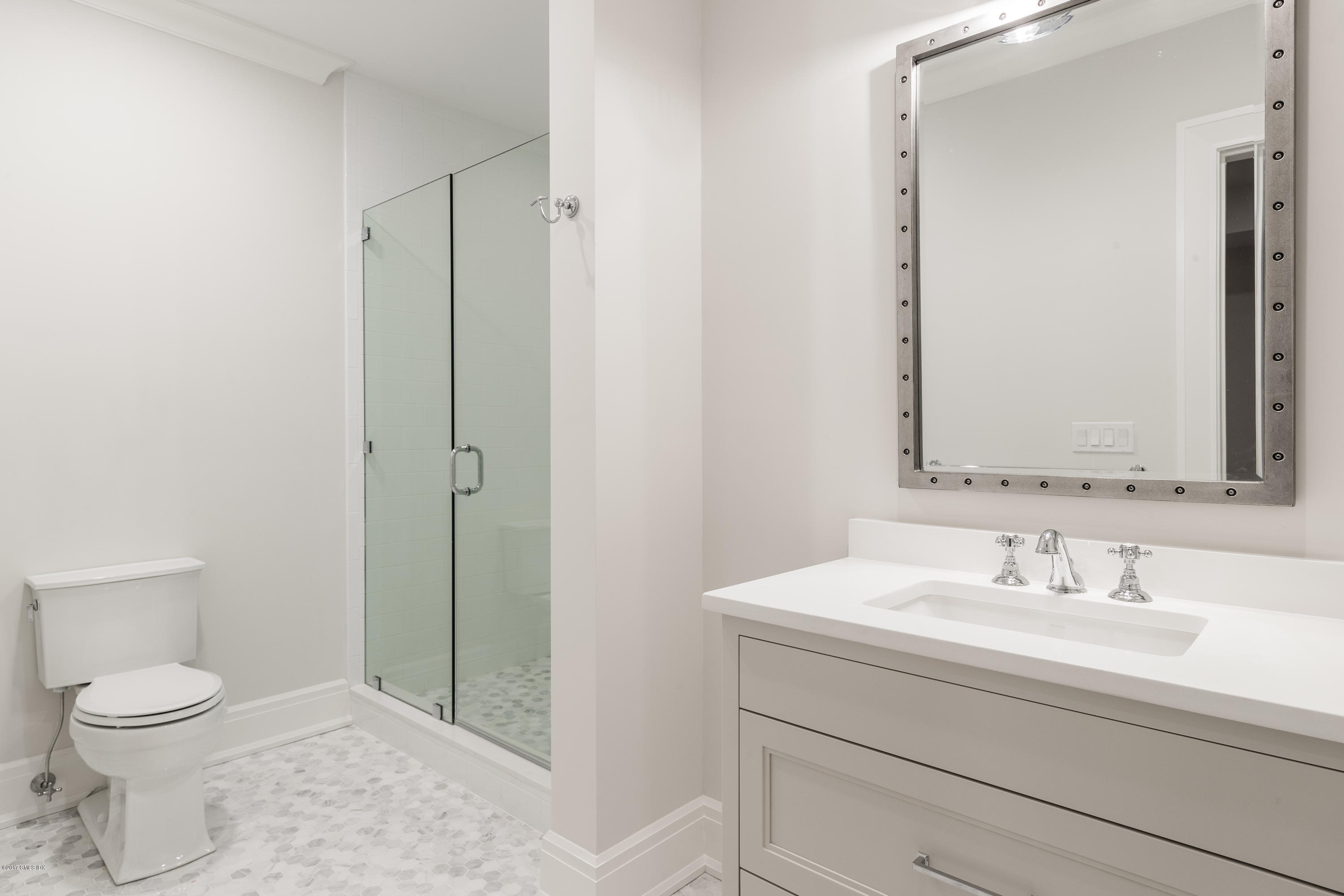 9 Shaw Place Riverside, CT 06878 - Photo 38 of 39 a bathroom with a sink a toilet and shower