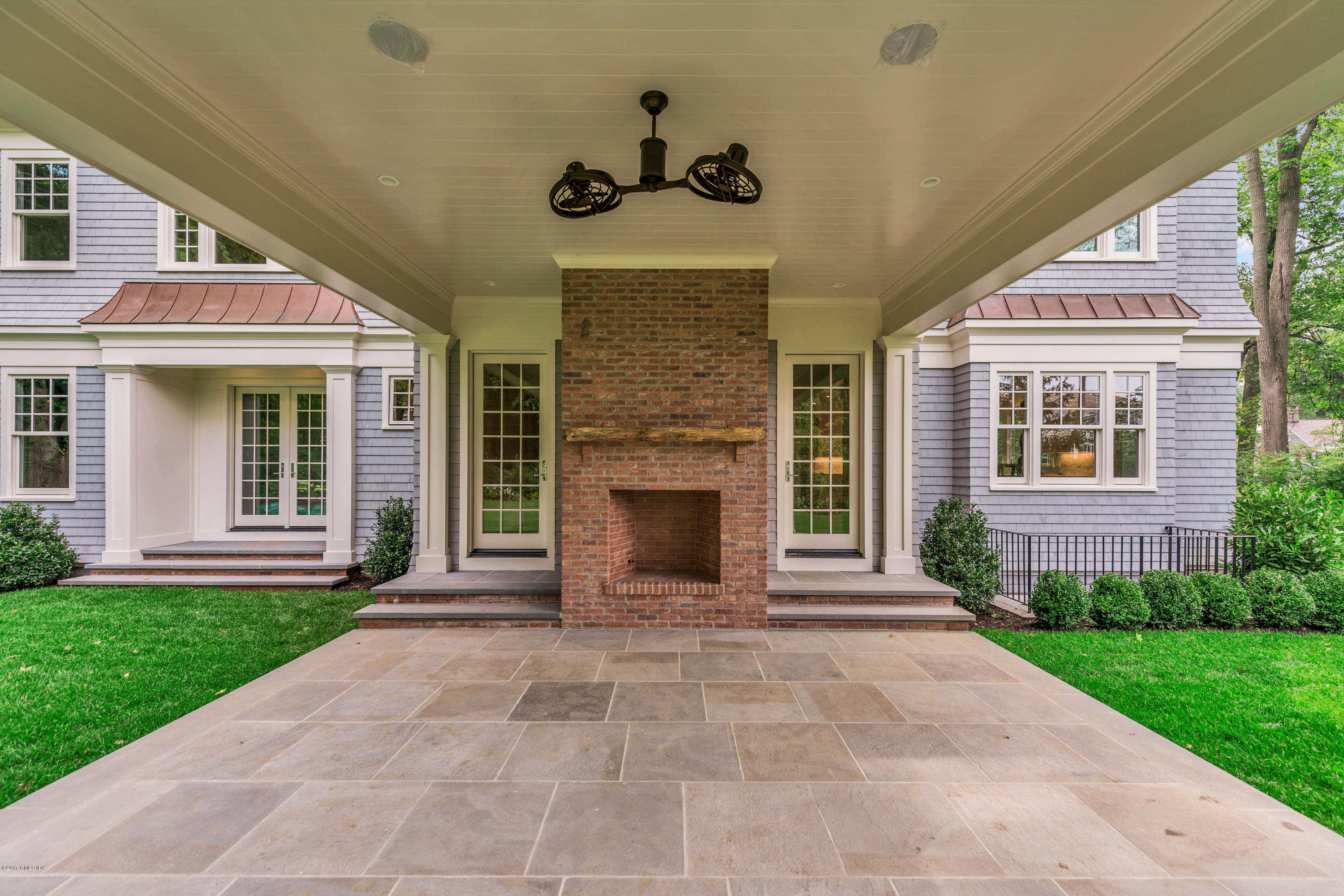 9 Shaw Place Riverside, CT 06878 - Photo 5 of 39 a front view of a house with a yard