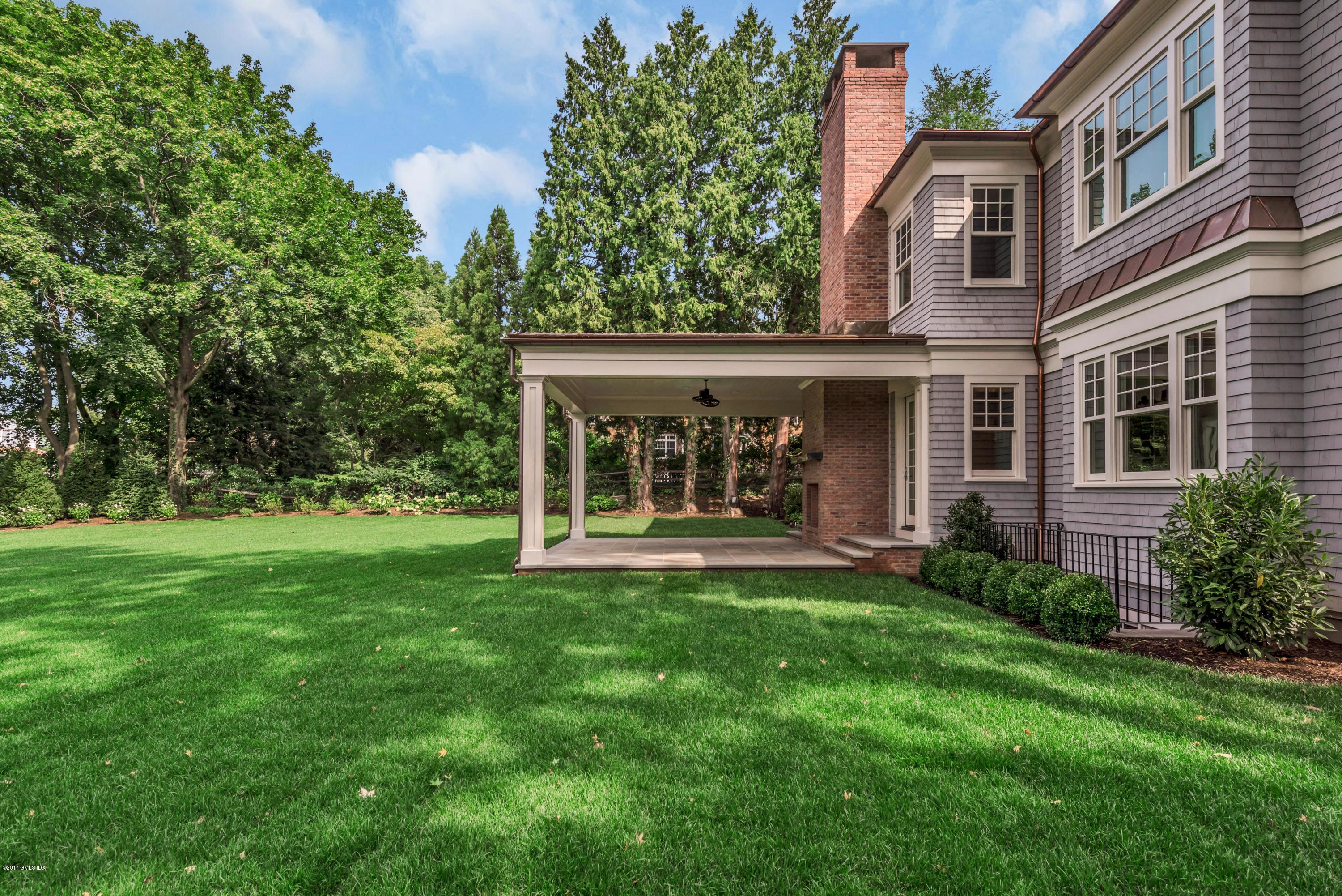 9 Shaw Place Riverside, CT 06878 - Photo 7 of 39 a view of a house with a yard and sitting area