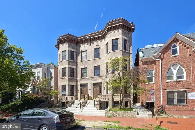 a front view of a building with street view